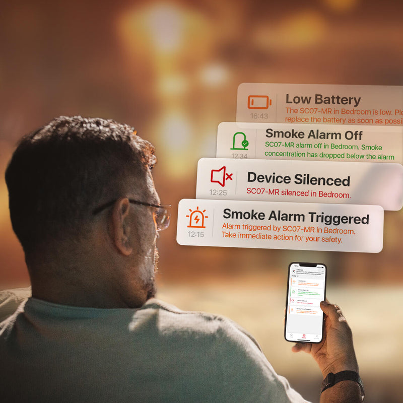 a person checks real-time notifications from the X-Sense Home Security app on his phone