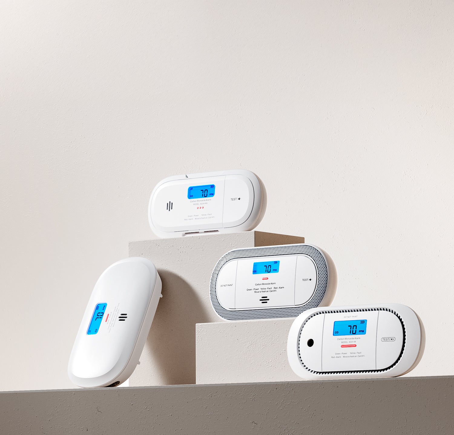 Set of four electronic devices on a light gray background